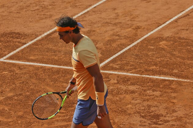 Rafael Nadal of Spain reacts after losing a point against Novak Djokovic of Serbia during their quarter final match at the Italian Open tennis tournament, in Rome, Friday, May 13, 2016. Djokovic won 7-5, 7-6. (AP Photo/Alessandra Tarantino)