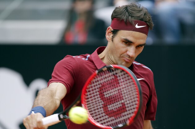 Roger Federer of Switzerland returns the ball to Dominic Thiem of Austria during their match at the Italian Open tennis tournament, in Rome, Thursday, May 12, 2016. (AP Photo/Andrew Medichini)