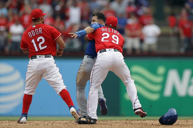 ARLINGTON, TX - MAY 15:  Adrian Beltre #29 of the Texas Rangers holds Jose Bautista #19 of the Toronto Blue Jays after being punched by Rougned Odor #12 in the eighth inning at Globe Life Park in Arlington on May 15, 2016 in Arlington, Texas.  (Photo by Ronald Martinez/Getty Images)