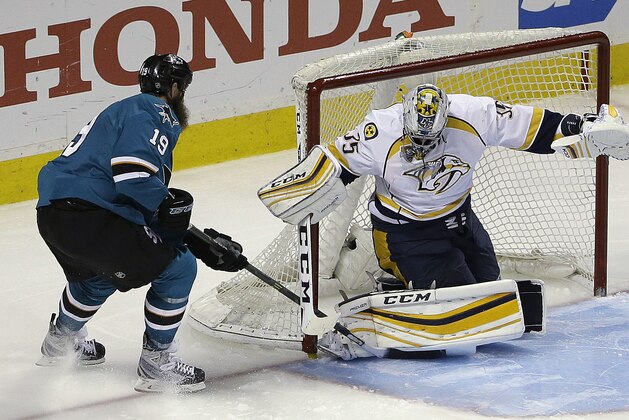 San Jose Sharks' Joe Thornton, left, scores against Nashville Predators goalie Pekka Rinne during the third period of Game 7 of an NHL hockey Stanley Cup Western Conference semifinal playoff series Thursday, May 12, 2016, in San Jose, Calif. The Sharks won 5-0 and advanced to the conference finals. (AP Photo/Ben Margot)