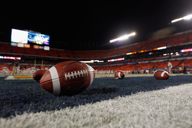 MIAMI GARDENS, FL - JANUARY 04:  A detail of a Nike official NCAA size football as it sits in the end zone while the West Virginia Mountaineers stretchon the field prior to playing against the Clemson Tigers during the Discover Orange Bowl at Sun Life Stadium on January 4, 2012 in Miami Gardens, Florida.  (Photo by Streeter Lecka/Getty Images)