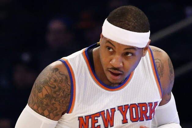New York Knicks forward Carmelo Anthony (7) watches a play as he runs down court in the first half of an NBA basketball game against the Toronto Raptors at Madison Square Garden in New York, Sunday, April 10, 2016. (AP Photo/Kathy Willens)