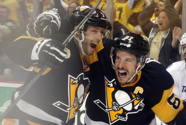 May 16, 2016; Pittsburgh, PA, USA; Pittsburgh Penguins center Matt Cullen (7) and center Sidney Crosby (87) celebrate a sudden death game winning goal by Crosby in overtime against the Tampa Bay Lightning in game two of the Eastern Conference Final of the 2016 Stanley Cup Playoffs at the CONSOL Energy Center. The Penguins won 3-2 in overtime to even the series 1 game to 1. Mandatory Credit: Charles LeClaire-USA TODAY Sports