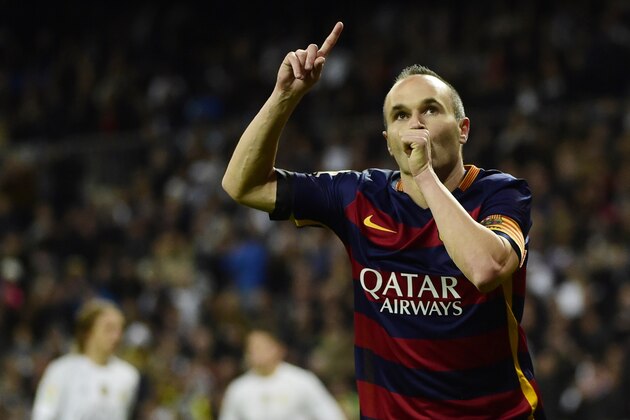 Barcelona's midfielder Andres Iniesta celebrates after scoring during the Spanish league 'Clasico' football match Real Madrid CF vs FC Barcelona at the Santiago Bernabeu stadium in Madrid on November 21, 2015.    AFP PHOTO / CURTO DE LA TORRE / AFP / PIERRE-PHILIPPE MARCOU        (Photo credit should read PIERRE-PHILIPPE MARCOU/AFP/Getty Images)