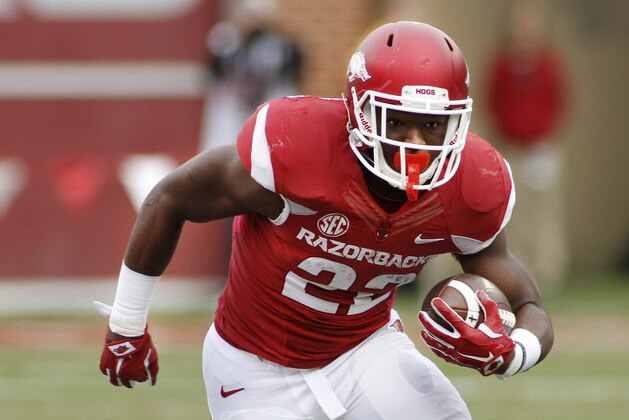 Arkansas' Rawleigh Williams III (22) runs the ball during the first half of an NCAA college football game against Auburn, Saturday, Oct. 24, 2015, in Fayetteville, Ark. Williams sustained a neck injury during the third quarter and did not return to the game. Arkansas won 54-46 in four overtimes. (AP Photo/Samantha Baker)
