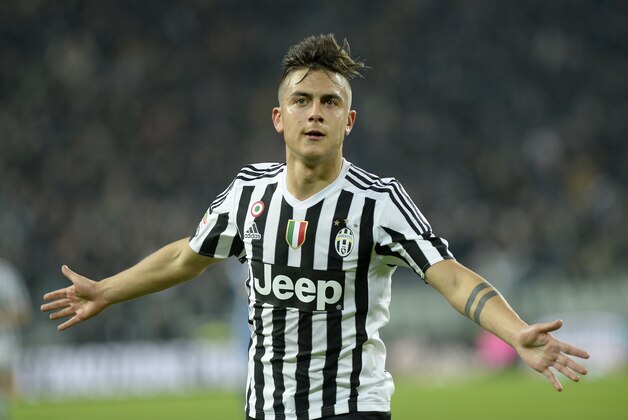 Juventus' Paulo Dybala celebrates after scoring during a Serie A soccer match between Juventus and Sassuolo at the Juventus stadium, in Turin, Italy, Friday, March 11, 2016. (AP Photo/Massimo Pinca)