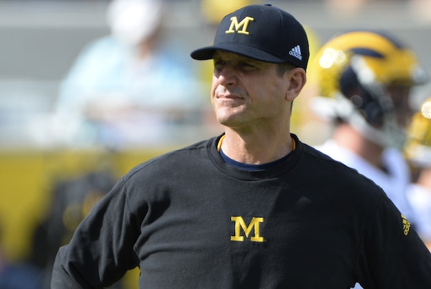 Jan 1, 2016; Orlando, FL, USA;  Michigan Wolverines head coach Jim Harbaugh walks across the field prior to the start of the game against the Florida Gators in the 2016 Citrus Bowl at Orlando Citrus Bowl Stadium. Mandatory Credit: Tommy Gilligan-USA TODAY Sports