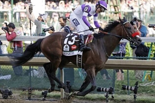 CORRECTS SPELLING OF LAST NAME TO GUTIERREZ FROM GUITIERREZ - Mario Gutierrez celebrates after riding Nyquist to victory during the 142nd running of the Kentucky Derby horse race at Churchill Downs, Saturday, May 7, 2016, in Louisville, Ky. (AP Photo/Garry Jones)