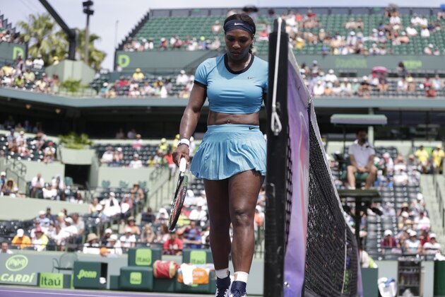 Serena Williams walks to the other side of the net during her match against Svetlana Kuznetsova at the Miami Open tennis tournament, Monday, March 28, 2016, in Key Biscayne, Fla. (AP Photo/Lynne Sladky)