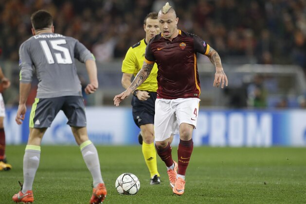 Roma's Radja Nainggolan runs with the ball during a Champions League, round of 16, first-leg soccer match between Roma and Real Madrid, at the Rome Olympic stadium, Wednesday, Feb. 17, 2016. (AP Photo/Andrew Medichini)