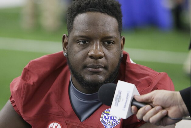Alabama offensive lineman Cam Robinson (74) listens to a question during the media day for the NCAA Cotton Bowl college football game Tuesday, Dec. 29, 2015, in Arlington, Texas. (AP Photo/LM Otero)