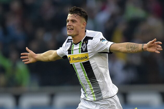 Moenchengladbach's Granit Xhaka from Switzerland celebrates after schoring the decisive goal in overtime of the German Bundesliga soccer match between Borussia Moenchengladbach and 1. FC Cologne in Moenchengladbach, Germany, Saturday, Feb. 14, 2015. Moenchengladbach defeated Cologne with 1-0. (AP Photo/Martin Meissner)
