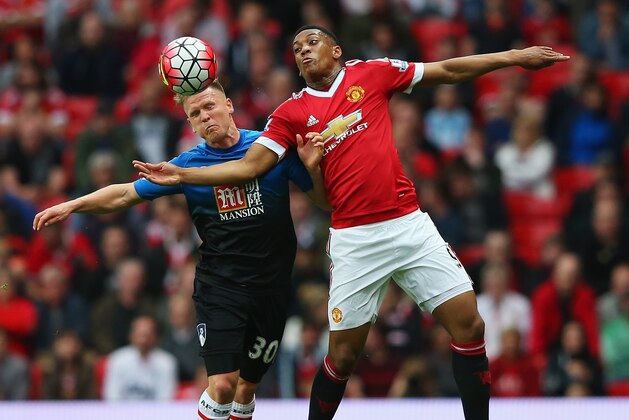 MANCHESTER, ENGLAND - MAY 17:  Anthony Martial of Manchester United and Matt Ritchie of Bournemouth battle for the ball during the Barclays Premier League match between Manchester United and AFC Bournemouth at Old Trafford on May 17, 2016 in Manchester, England.  (Photo by Alex Livesey/Getty Images)