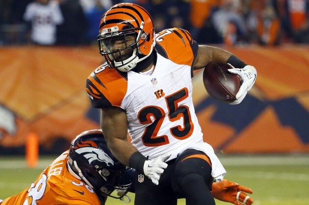 Cincinnati Bengals running back Giovani Bernard (25) is hit by Denver Broncos outside linebacker Von Miller (58) during the second half of an NFL football game, Monday, Dec. 28, 2015, in Denver. (AP Photo/Jack Dempsey)