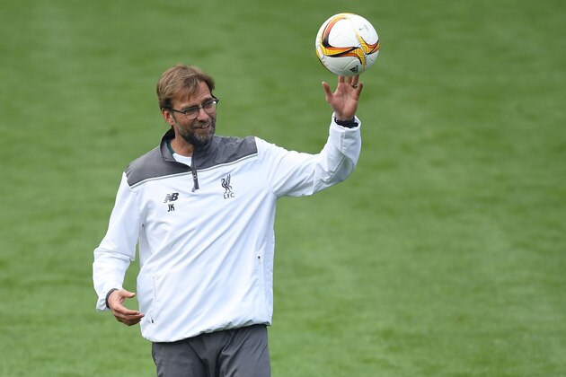 Liverpool's German manager Jurgen Klopp plays with the ball during a training session of his team at the St Jakob-Park stadium in Basel, northern Switzerland, on May 17, 2016, on the eve of the UEFA Europa League final football match between Liverpool and Sevilla.  / AFP / FABRICE COFFRINI        (Photo credit should read FABRICE COFFRINI/AFP/Getty Images)