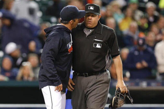 CORRECTS UMPIRE ID TO DOUG EDDINGS NOT JEFF NELSON Detroit Tigers manager Brad Ausmus, left, yells at home plate umpire Doug Eddings against the Minnesota Twins in the fourth inning of a baseball game Monday, May 16, 2016 in Detroit. Ausmus was thrown out of the game. (AP Photo/Paul Sancya)