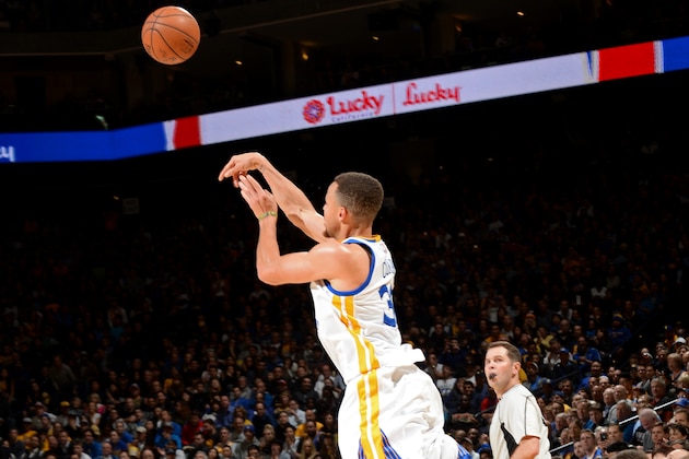 OAKLAND, CA - MARCH 7:  Stephen Curry #30 of the Golden State Warriors shoots a half court shot against the Orlando Magic on March 7, 2016 at ORACLE Arena in Oakland, California. NOTE TO USER: User expressly acknowledges and agrees that, by downloading and or using this photograph, user is consenting to the terms and conditions of Getty Images License Agreement. Mandatory Copyright Notice: Copyright 2016 NBAE (Photo by Noah Graham/NBAE via Getty Images)