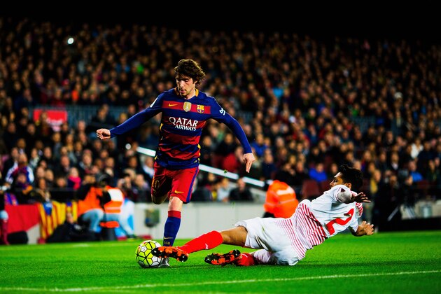 BARCELONA, SPAIN - FEBRUARY 28:  Sergi Roberto of Barcelona attacks as Benoit Tremoulinas of Sevilla slides in  during the La Liga match between FC Barcelona and Sevilla FC at Camp Nou on February 28, 2016 in Barcelona, Spain.  (Photo by Vladimir Rys Photography/Getty Images)