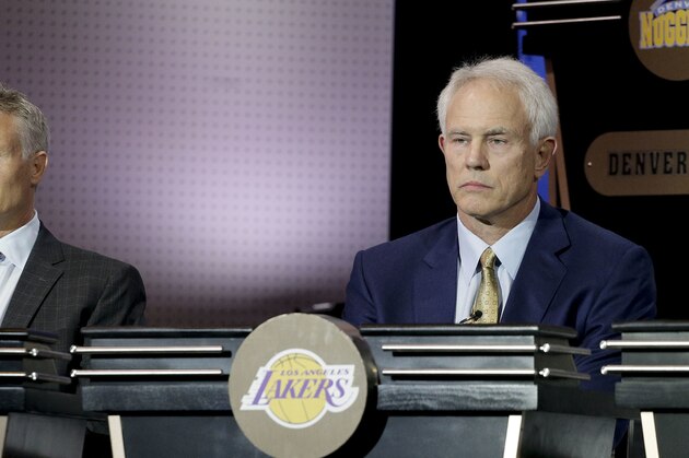 Philadelphia 76ers head coach Brett Brown, left, and Los Angeles Lakers general manager Mitch Kupchak listen as the results of the NBA basketball draft lottery are announced, Tuesday, May 17, 2016, in New York. (AP Photo/Julie Jacobson)