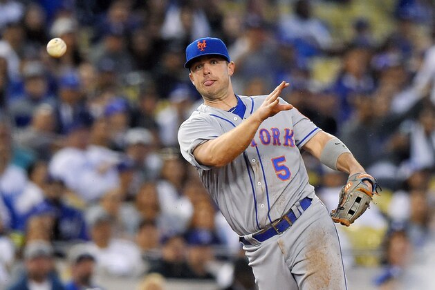 New York Mets third baseman David Wright attempts to throw out Los Angeles Dodgers' Yasiel Puig at first during the second inning of a baseball game, Tuesday, May 10, 2016, in Los Angeles. Puig was safe at first on the play and Wright was charges with a throwing error. (AP Photo/Mark J. Terrill)
