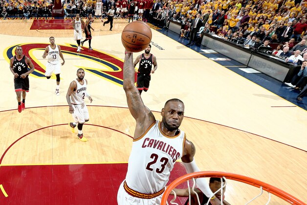 CLEVELAND, OH - MAY 17: LeBron James #23 of the Cleveland Cavaliers dunks against the Toronto Raptors in Game One of the Eastern Conference Finals during the 2016 NBA Playoffs on May 17, 2016 at Quicken Loans Arena in Cleveland, Ohio.  NOTE TO USER: User expressly acknowledges and agrees that, by downloading and or using this Photograph, user is consenting to the terms and conditions of the Getty Images License Agreement. Mandatory Copyright Notice: Copyright 2016 NBAE (Photo by Nathaniel S. Butler/NBAE via Getty Images)