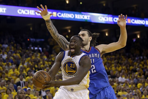 Golden State Warriors' Draymond Green (23) drives past Oklahoma City Thunder's Steven Adams during the second half in Game 1 of the NBA basketball Western Conference finals Monday, May 16, 2016, in Oakland, Calif. Oklahoma City won 108-102. (AP Photo/Marcio Jose Sanchez)