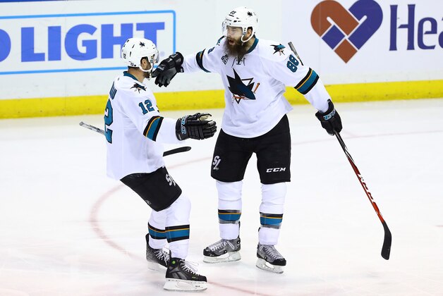 May 17, 2016; St. Louis, MO, USA; San Jose Sharks defenseman Brent Burns (88) celebrates with center Patrick Marleau (12) after scoring his second goal of the game during the third period in game two of the Western Conference Final of the 2016 Stanley Cup Playoff against the St. Louis Blues at Scottrade Center. The Sharks won the game 4-0. Mandatory Credit: Billy Hurst-USA TODAY Sports