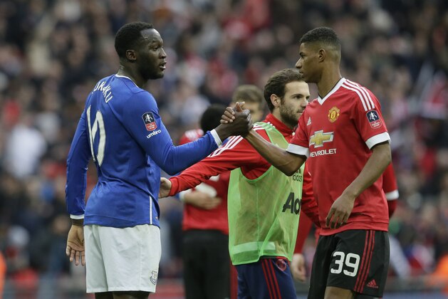 Everton’s Romelu Lukaku, left shakes hands with Manchester United's Marcus Rashford following the end of the English FA Cup semifinal between Manchester United and Everton at Wembley stadium in London, Saturday, April 23,  2016. United won the game 2-1. (AP Photo/Tim Ireland)