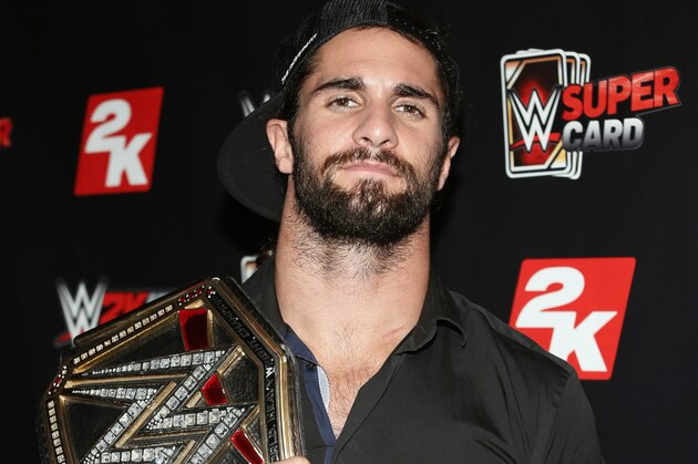 IMAGE DISTRIBUTED FOR 2K - WWE World Heavyweight Champion Seth Rollins poses with his championship title at the WWE 2K SummerSlam Kickoff in New York, N.Y., on Thursday, Aug. 20, 2015. (Photo by Stuart Ramson/Invision for 2K/AP Images)