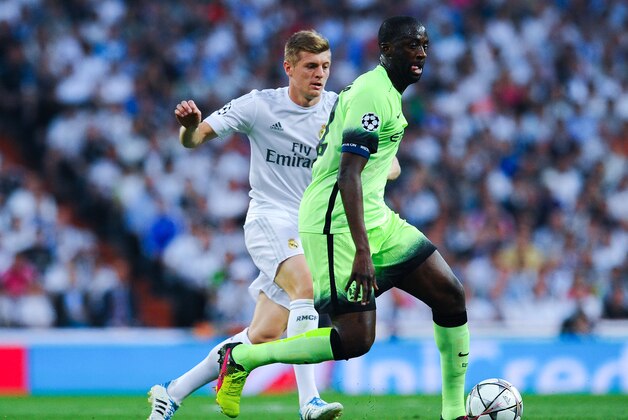 MADRID, SPAIN - MAY 04:  Yaya Toure of Manchester City FC competes for the ball with Toni Kroos of Real Madrid CF during the UEFA Champions League Semi Final second leg match between Real Madrid and Manchester City FC at Estadio Santiago Bernabeu on May 4, 2016 in Madrid, Spain.  (Photo by David Ramos/Getty Images)