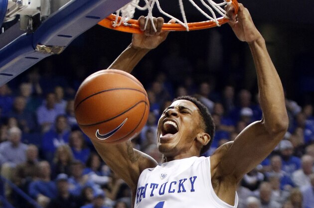 Kentucky's Charles Matthews dunks during the first half of an NCAA college basketball game against Eastern Kentucky, Wednesday, Dec. 9, 2015, in Lexington, Ky.  (AP Photo/James Crisp)