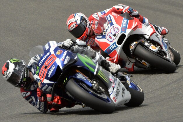 Spain's rider Jorge Lorenzo competes on his Movistar Yamaha MOTOGP N 99 ahead of Italy's rider Andrea Dovizioso on his Ducati N 4 in the MotoGP race during the French motorcycling Grand Prix, on May 8, 2016 in Le Mans, northwestern France. / AFP / JEAN-FRANCOIS MONIER        (Photo credit should read JEAN-FRANCOIS MONIER/AFP/Getty Images)