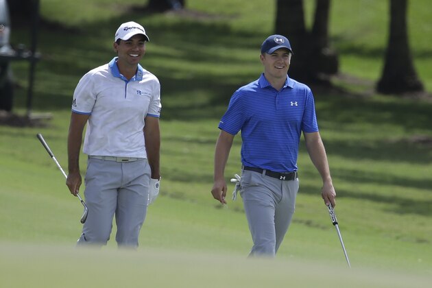 Jason Day, of Australia, left, walks with Jordan Spieth, right, during the second round of the Cadillac Championship golf tournament, Friday, March 4, 2016, in Doral, Fla. (AP Photo/Lynne Sladky)