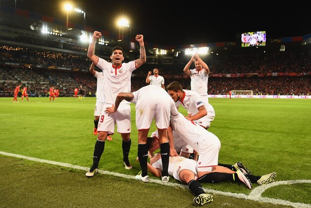 BASEL, SWITZERLAND - MAY 18:  Coke (bottom) of Sevilla  celebrates scoring his team's second goal with his team mates during the UEFA Europa League Final match between Liverpool and Sevilla at St. Jakob-Park on May 18, 2016 in Basel, Switzerland.  (Photo by Lars Baron/Getty Images)