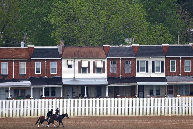 BALTIMORE, MD - MAY 18: Kentucky Derby winner Nyquist (left) is walked by exercise rider Jonny Garcia on track with an outrider (right) during a training session for the 141st running of the Preakness Stakes at Pimlico Race Course on on May 18, 2016 in Baltimore, Maryland. (Photo by Patrick Smith/Getty Images)