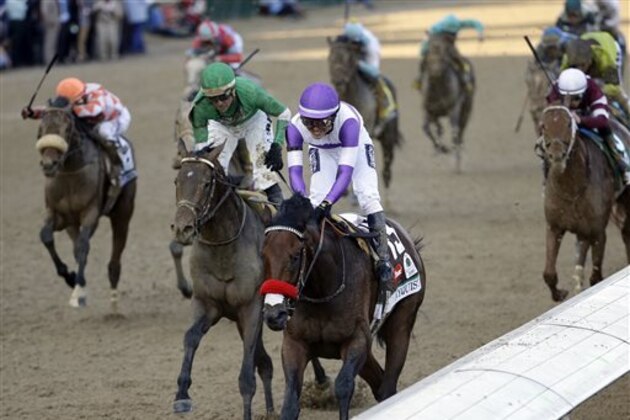 CORRECTS LAST NAME TO GUTIERREZ FROM GUITIERREZ - Mario Gutierrez rides Nyquist to victory during the 142nd running of the Kentucky Derby horse race at Churchill Downs Saturday, May 7, 2016, in Louisville, Ky. (AP Photo/David J. Phillip)