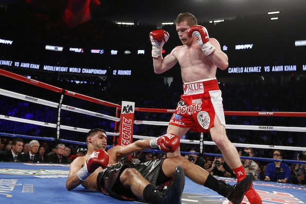 Canelo Alvarez knocks out Amir Khan during their WBC middleweight title fight Saturday, May 7, 2016, in Las Vegas. (AP Photo/Isaac Brekken)
