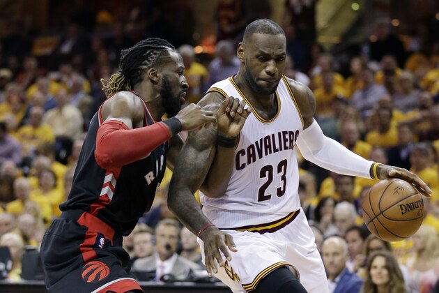 Cleveland Cavaliers' LeBron James (23) drives on Toronto Raptors' DeMarre Carroll (5) during the second half of Game 1 of the NBA basketball Eastern Conference finals, Tuesday, May 17, 2016, in Cleveland. (AP Photo/Tony Dejak)