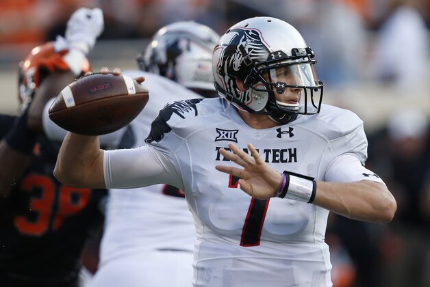 Texas Tech quarterback Davis Webb (7) passes in the first quarter of an NCAA college football game against Oklahoma State in Stillwater, Okla., Thursday, Sept. 25, 2014. (AP Photo/Sue Ogrocki)