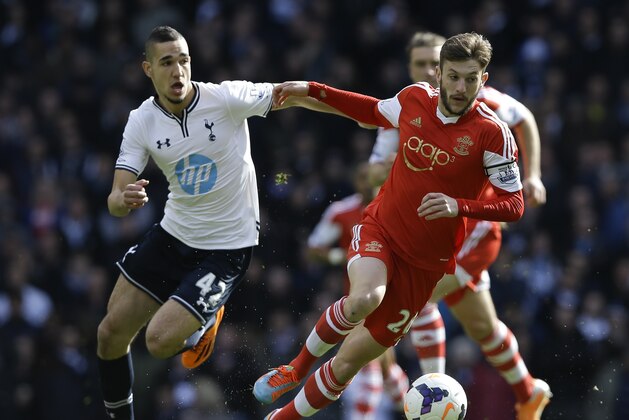 Southampton's Adam Lallana, right, vies for the ball with Tottenham's Nabil Bentaleb during the English Premier League soccer match between Tottenham Hotspur and Southampton at White Hart Lane stadium in London, Sunday, March 23, 2014. (AP Photo/Kirsty Wigglesworth)