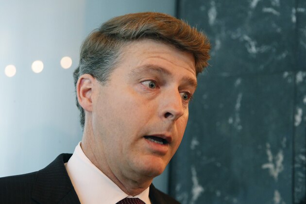 New York Yankees owner Hal Steinbrenner stops to talk to the media before attending a meeting of Major League Baseball's executive committee during baseball's owners meetings at MLB headquarters in midtown Manhattan, Wednesday, May 18, 2016, in New York.  Steinbrenner backed manager Joe Girardi and his coaching staff and has instead blamed players for the team's slow start. The Yankees are last in the American League East division at 16-22. (AP Photo/Kathy Willens)