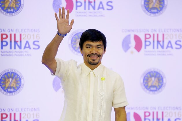 Filipino boxing great and now Senator Manny Pacquiao waves following his proclamation as the Seventh Senator in ceremony at the Commission on Elections Thursday, May 19, 2016 in suburban Pasay city south of Manila, Philippines. Pacquiao has won a seat in the Philippine Senate based on an unofficial count bringing him closer to a possible crack at the presidency. Pacquiao said he will retire from boxing to become a full-time politician. (AP Photo/Bullit Marquez)