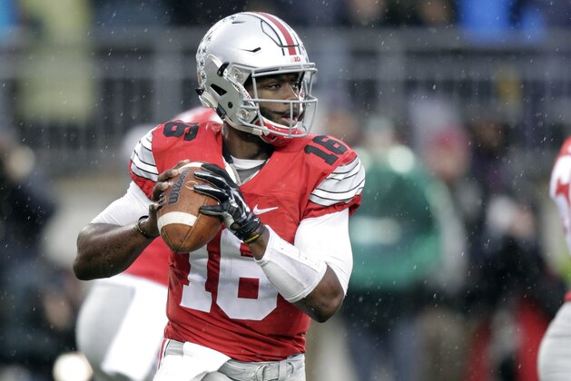 Ohio State quarterback J.T. Barrett drops back to pass against Michigan State during the first quarter of an NCAA college football game, Saturday, Nov. 21, 2015, in Columbus, Ohio. (AP Photo/Jay LaPrete)