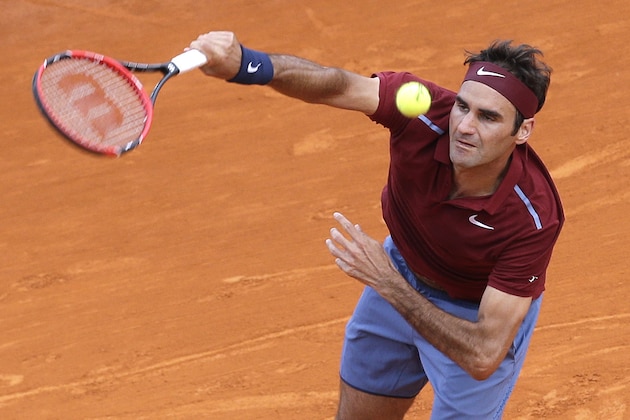 Swiss Roger Federer serves the ball to Spain's Roberto Bautista Agut during their match at the Monte Carlo Tennis Masters tournament in Monaco, Thursday, April 14, 2016. (AP Photo/Lionel Cironneau)