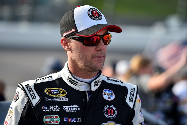 May 7, 2016; Kansas City, KS, USA; NASCAR Sprint Cup Series driver Kevin Harvick walks down pit road before the GoBowling.com 400 at Kansas Speedway. Mandatory Credit: Jasen Vinlove-USA TODAY Sports