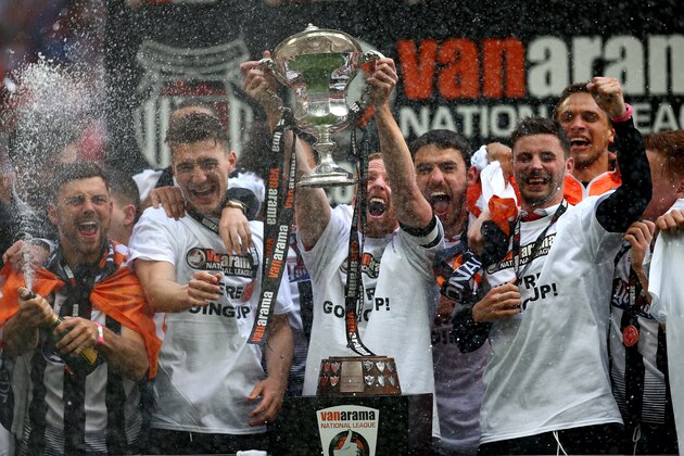 LONDON, ENGLAND - MAY 15: Grimsby's Craig Disley lifts the trophy as he celebrates the teams win and promotion to the football league during the Vanarama Football Conference League Play Off Final between Forest Green Rovers and Grimsby Town at Wembley Stadium on May 15, 2016 in London, England. (Photo by Charlie Crowhurst/Getty Images)
