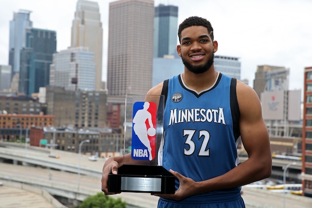 MINNEAPOLIS, MN - MAY 13:  Karl-Anthony Towns #32 of the Minnesota Timberwolves poses with the Eddie Gottlieb trophy in preparation for his being named the 2015- 2016 Kia NBA Rookie of the Year on May 13, 2016 in Minneapolis, Minnesota.  NOTE TO USER: User expressly acknowledges and agrees that, by downloading and or using this Photograph, user is consenting to the terms and conditions of the Getty Images License Agreement. Mandatory Copyright Notice: Copyright 2016 NBAE (Photo by David Sherman/NBAE via Getty Images)