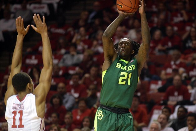 Mar 1, 2016; Norman, OK, USA; Baylor Bears forward Taurean Prince (21) shoots the ball over Oklahoma Sooners guard Isaiah Cousins (11) during the first halt at Lloyd Noble Center. Mandatory Credit: Mark D. Smith-USA TODAY Sports