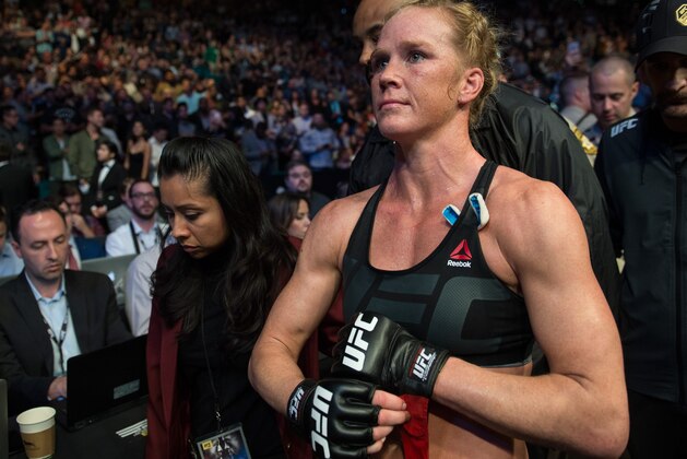 LAS VEGAS, NV - MARCH 5:   Holly Holm leaves the Octagon after her submission loss to Miesha Tate after their women's bantamweight championship bout during the UFC 196 in the MGM Grand Garden Arena on March 5, 2016 in Las Vegas, Nevada. (Photo by Brandon Magnus/Zuffa LLC/Zuffa LLC via Getty Images)