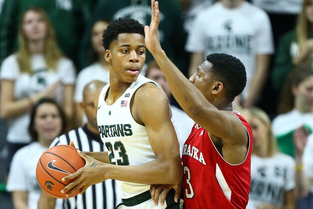 Jan 20, 2016; East Lansing, MI, USA; Michigan State Spartans forward Deyonta Davis (23) is defended by Nebraska Cornhuskers forward Nick Fuller (23)  during the 1st half of a game at Jack Breslin Student Events Center. Mandatory Credit: Mike Carter-USA TODAY Sports